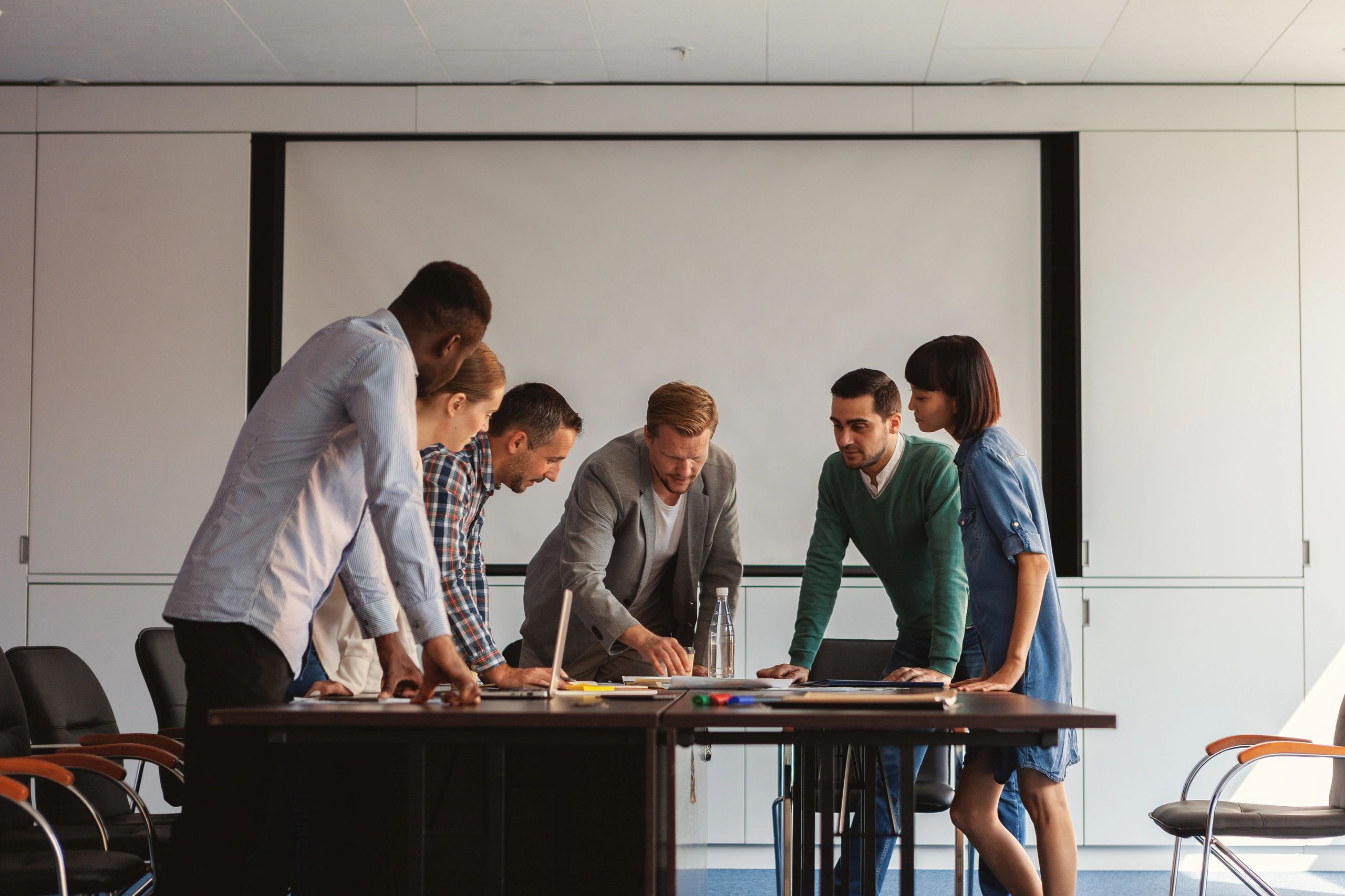 Team planning strategy around a table